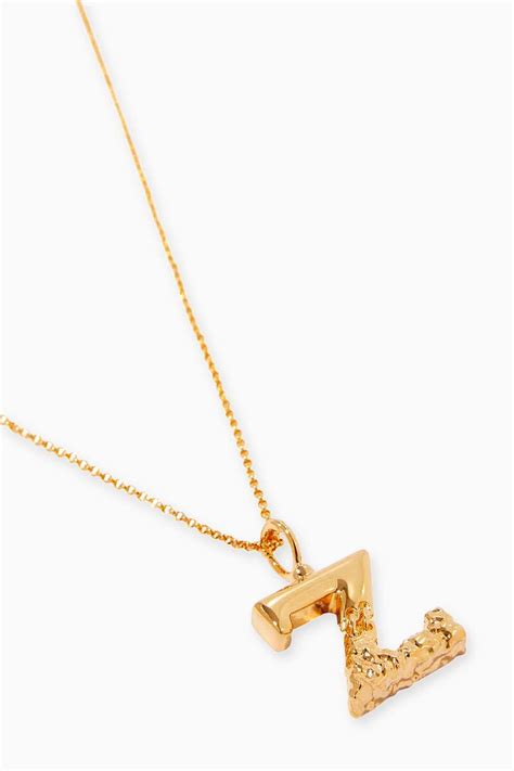 Alphabet V Necklace in Brass with Gold finish 